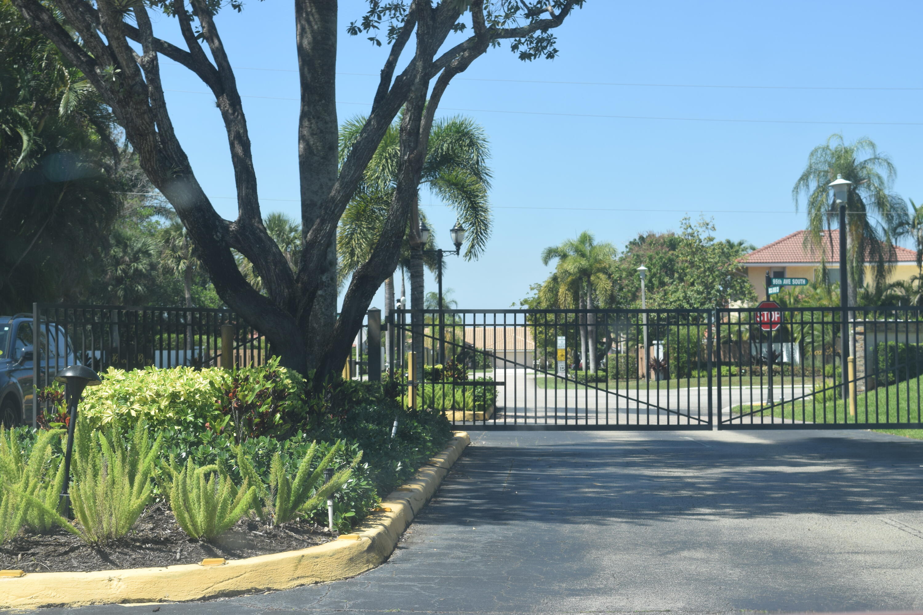 9416 Boca River Circle, Unit 9416 Boca Raton, FL 33434 - Photo 32 of 34 a view of a street from a garden