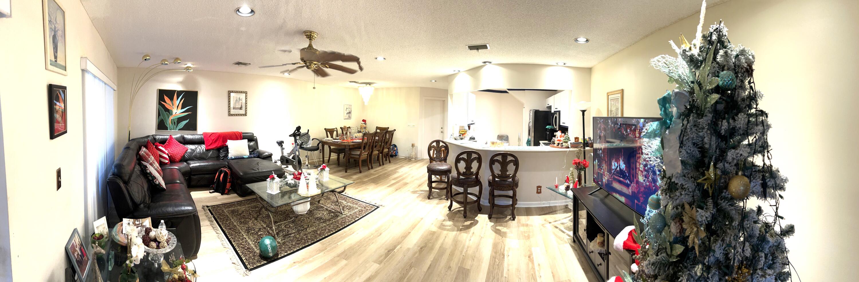 9416 Boca River Circle, Unit 9416 Boca Raton, FL 33434 - Photo 9 of 34 a view of a living room with furniture and a flat screen tv