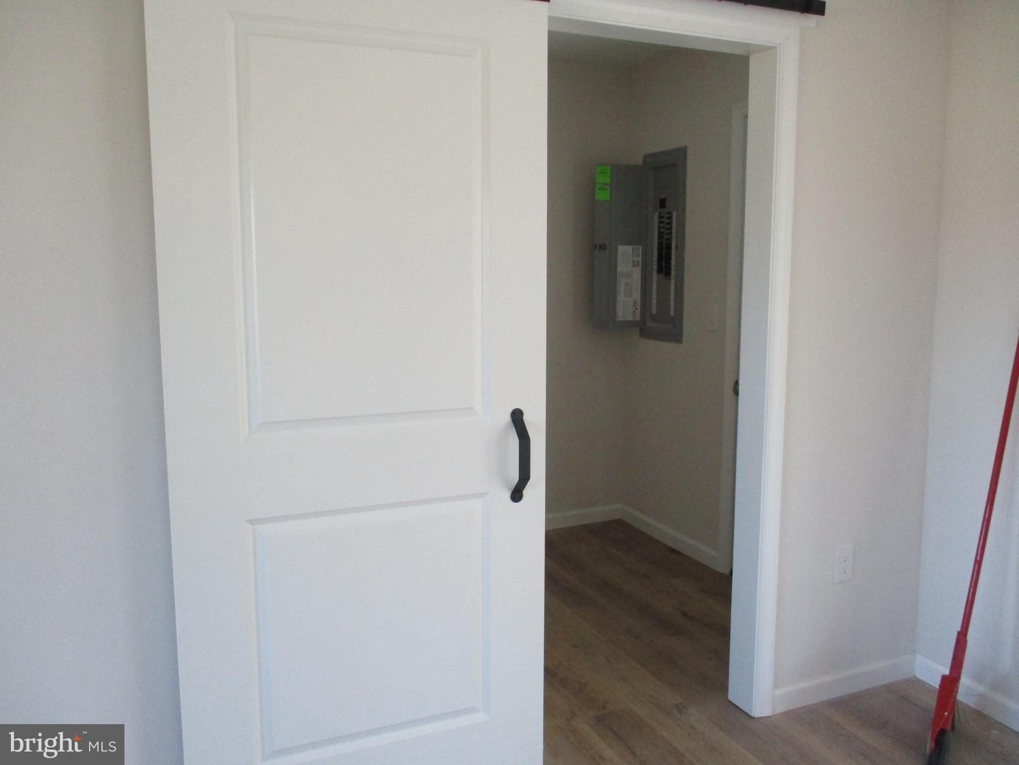 22403 Marsh Creek Road Preston, MD 21655 - Photo 11 of 35 a view of a hallway with wooden floor
