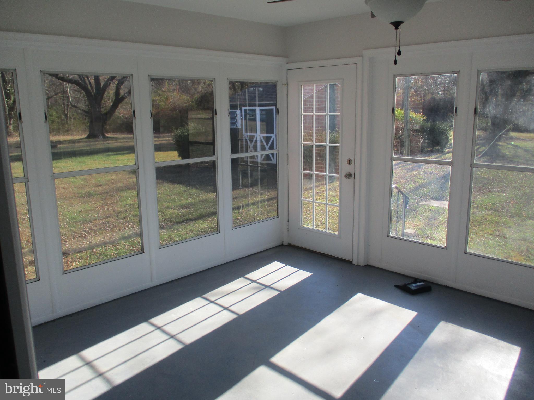 22403 Marsh Creek Road Preston, MD 21655 - Photo 12 of 35 a view of an empty room with windows