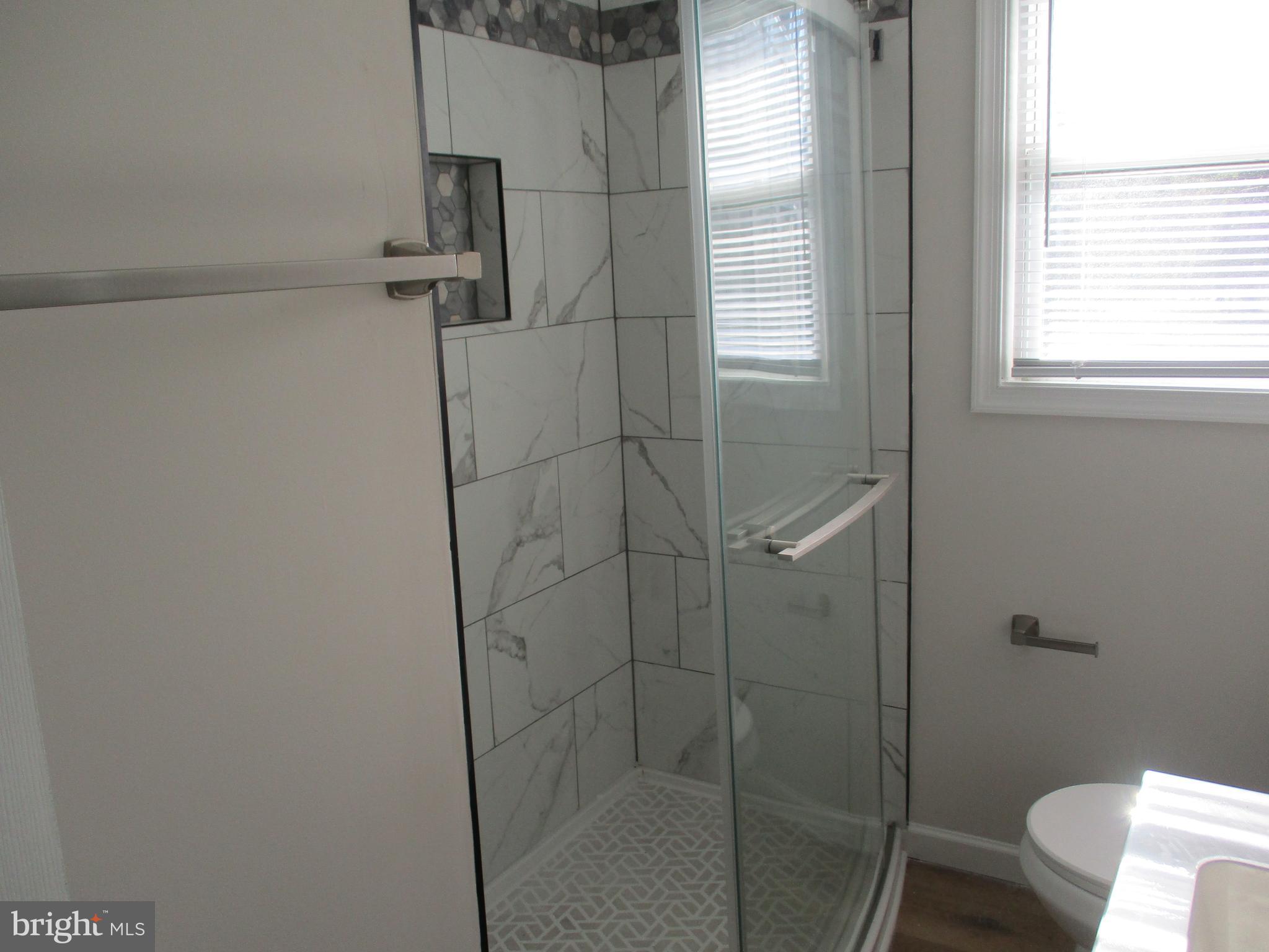 22403 Marsh Creek Road Preston, MD 21655 - Photo 23 of 35 a bathroom with a shower and toilet