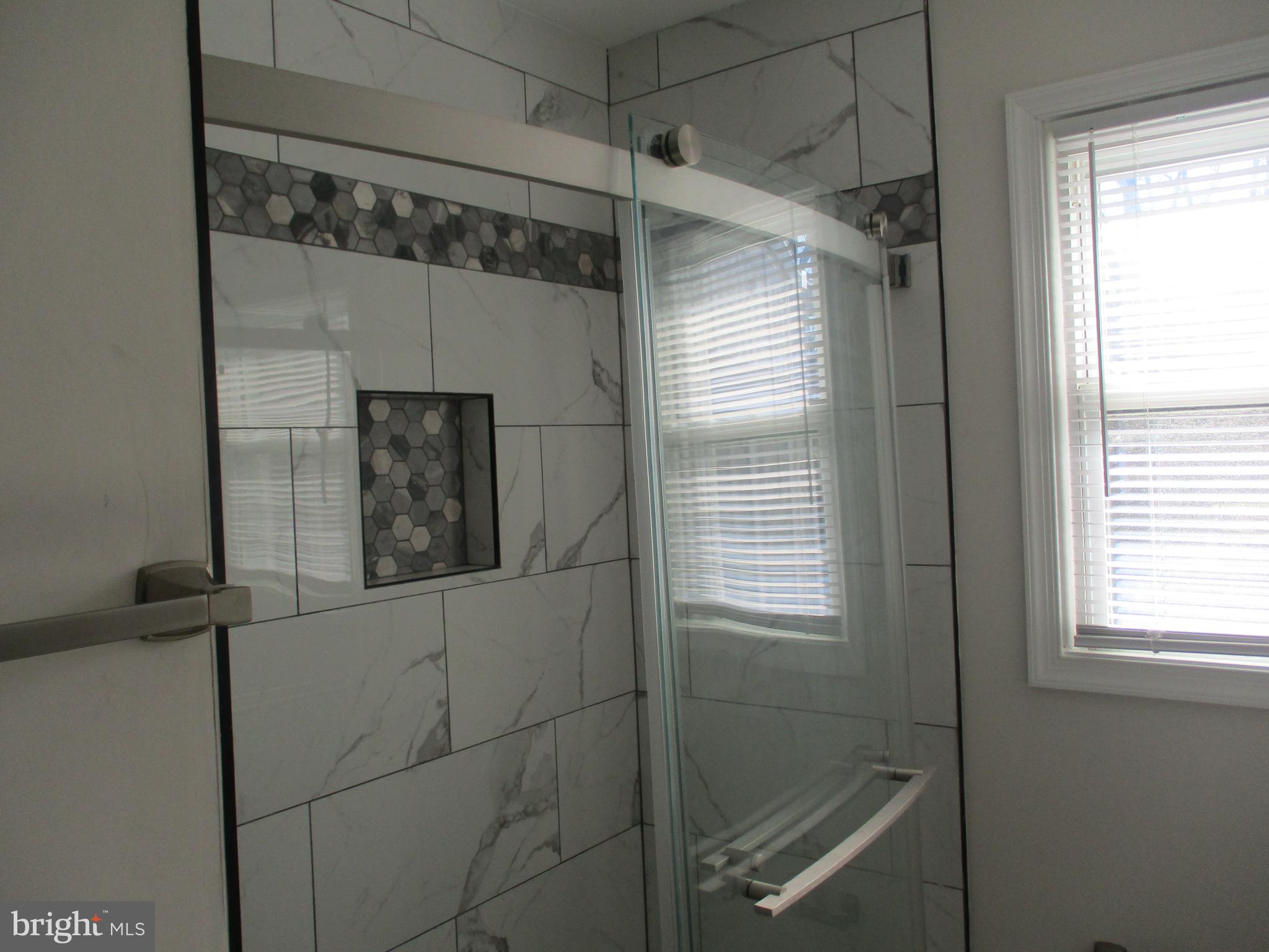 22403 Marsh Creek Road Preston, MD 21655 - Photo 24 of 35 a bathroom with a shower and a window
