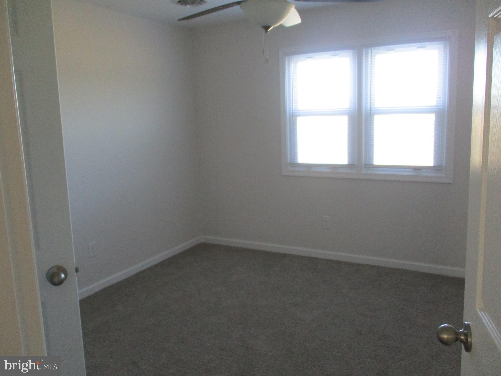 22403 Marsh Creek Road Preston, MD 21655 - Photo 29 of 35 an empty room with a window