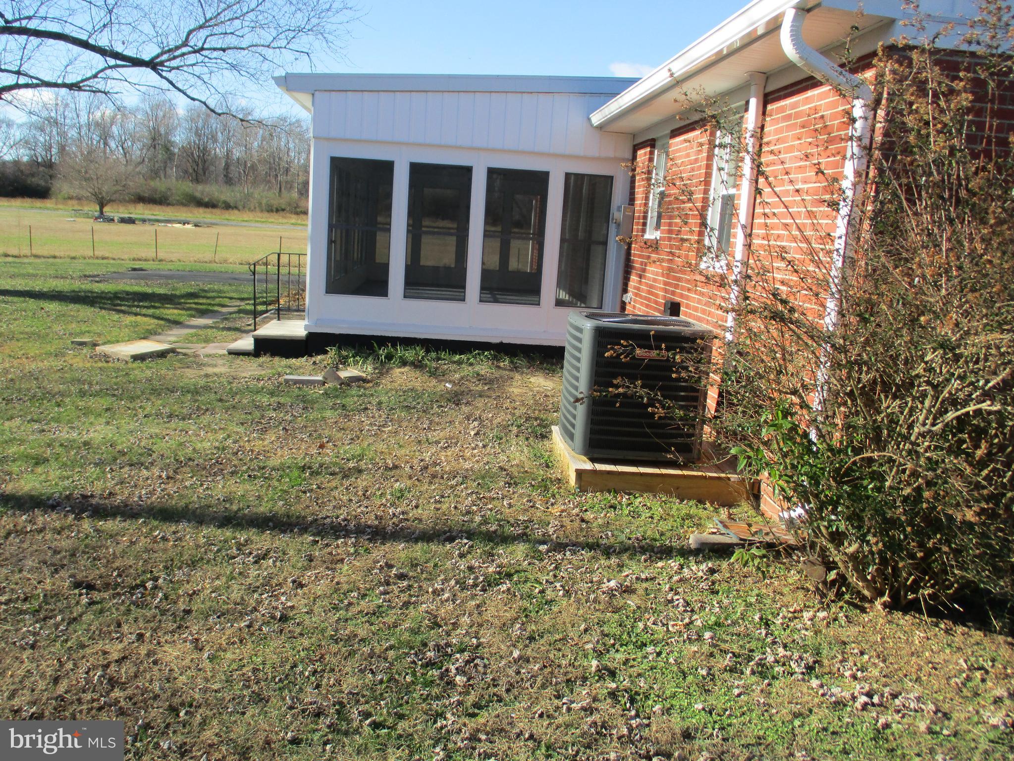 22403 Marsh Creek Road Preston, MD 21655 - Photo 5 of 35 a front view of a house with a yard