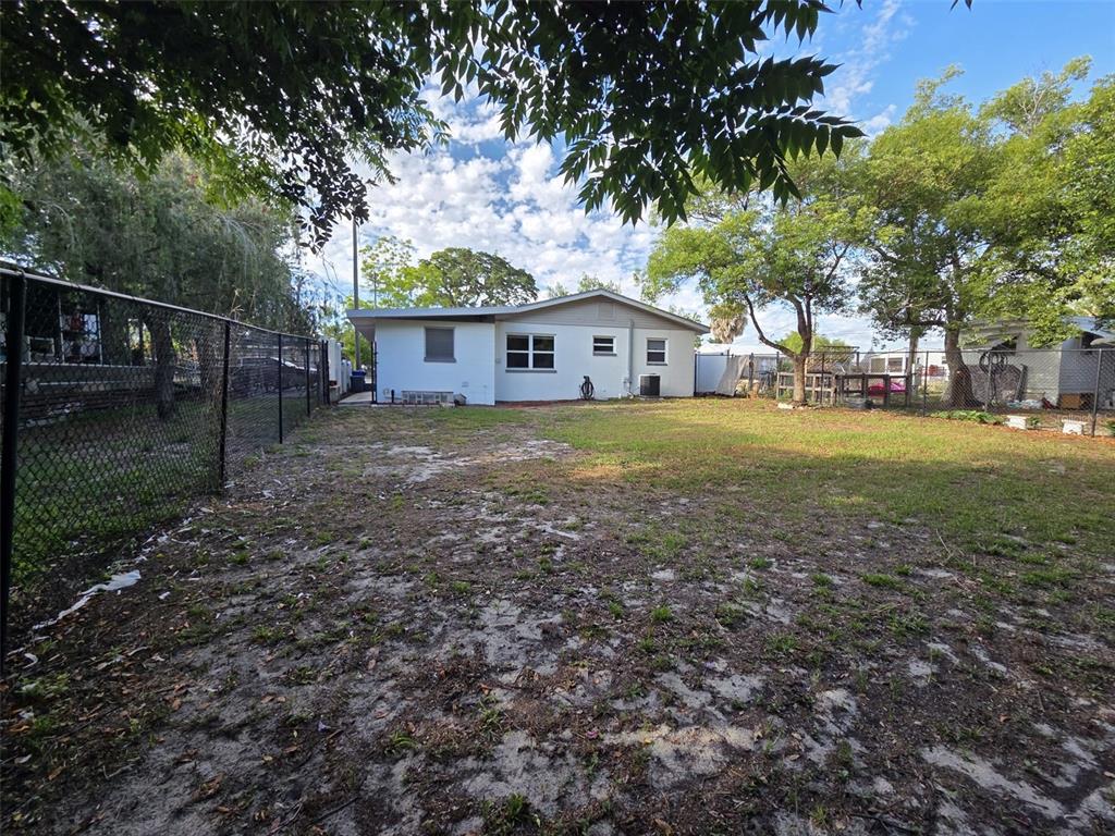 7216 James Street Port Richey, FL 34668 - Photo 26 of 28 a view of backyard of house with green space
