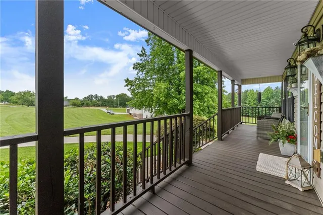 a kitchen with stainless steel appliances granite countertop a sink a stove and a microwave