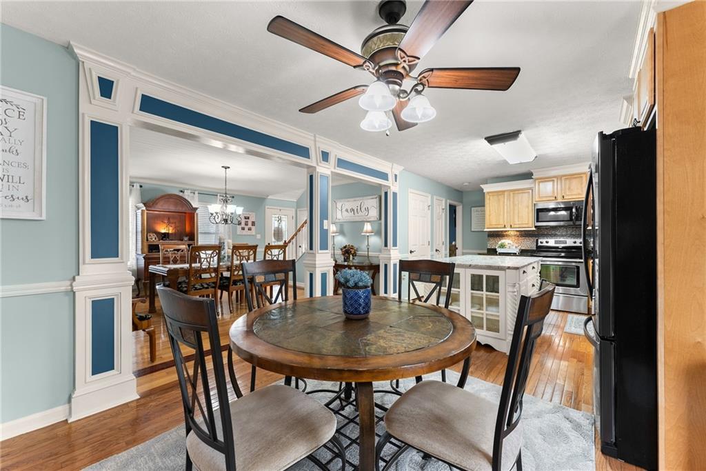 8958 Bill Savage Road Lula, GA 30554 - Photo 22 of 81 a view of a dining room with furniture