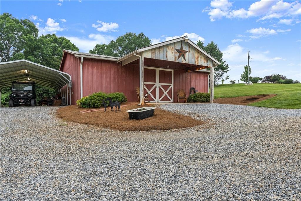 8958 Bill Savage Road Lula, GA 30554 - Photo 3 of 81 a front view of a house with garden