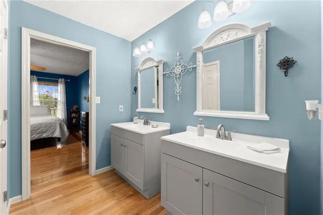 a view of a livingroom with kitchen and furniture