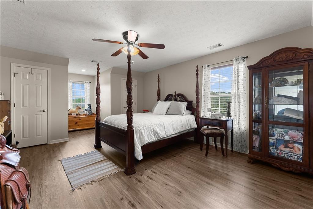 8958 Bill Savage Road Lula, GA 30554 - Photo 33 of 81 a bedroom with a bed furniture and a window