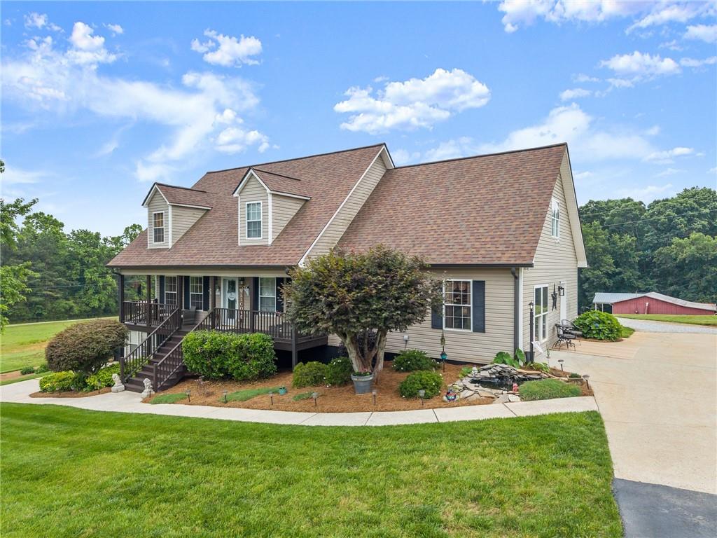 8958 Bill Savage Road Lula, GA 30554 - Photo 80 of 81 a front view of a house with garden