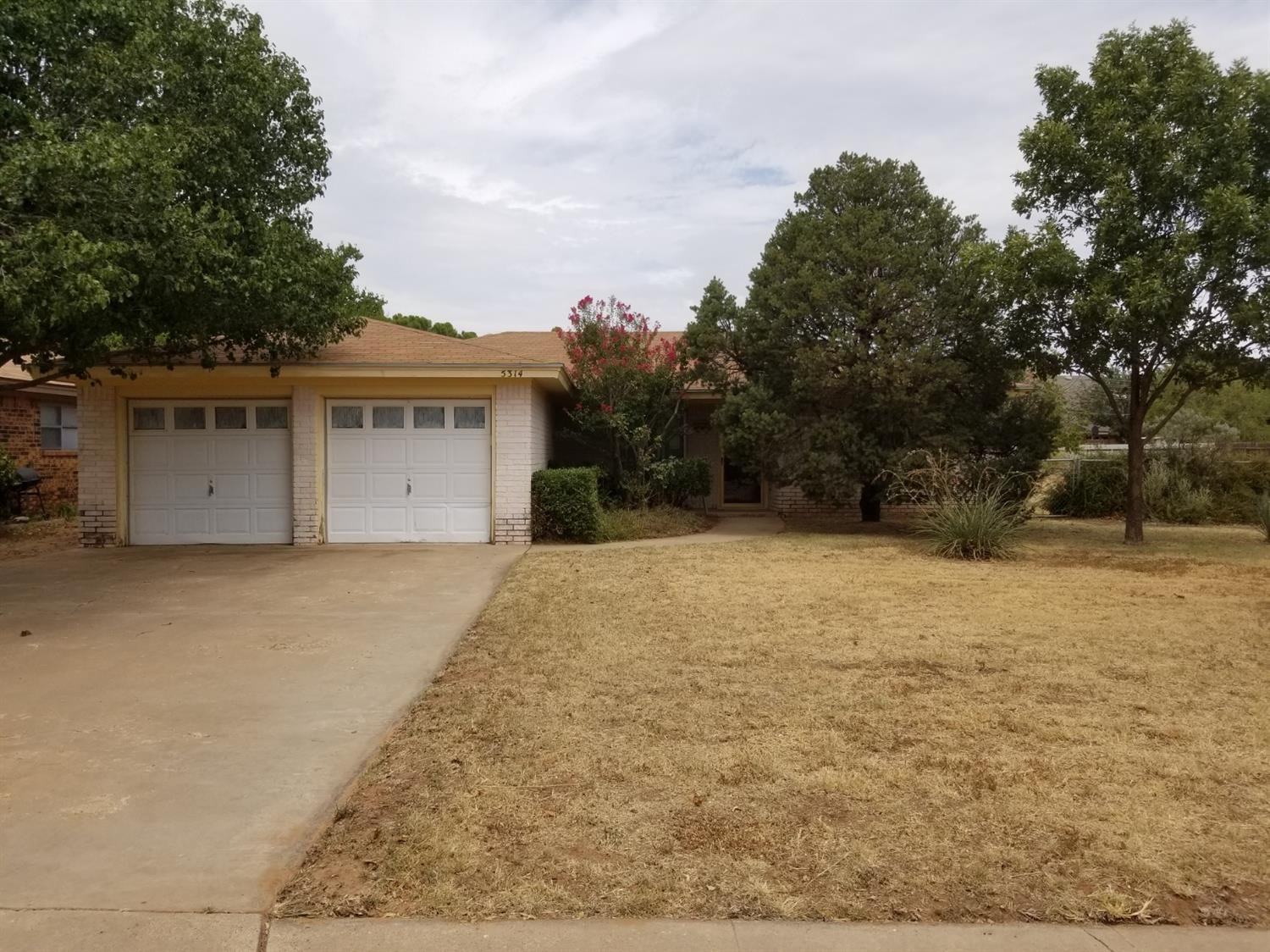 5314 22nd Street Lubbock, TX 79407 - Photo 1 of 10 front view of house with a yard