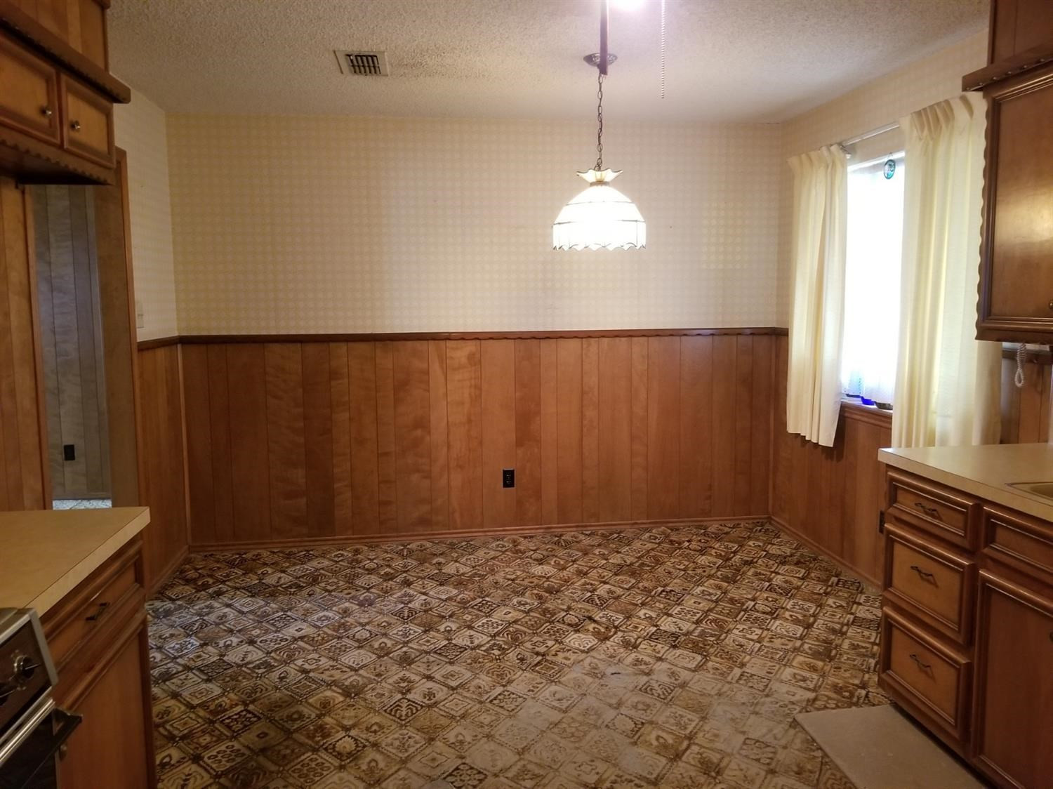 5314 22nd Street Lubbock, TX 79407 - Photo 4 of 10 a view of a livingroom with a chandelier