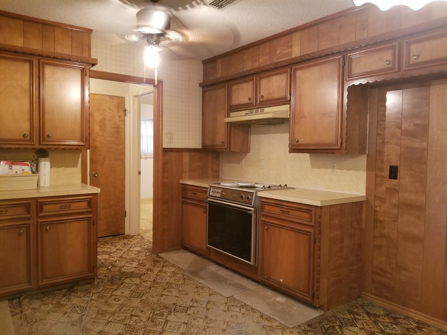 5314 22nd Street Lubbock, TX 79407 - Photo 5 of 10 a kitchen with stainless steel appliances granite countertop a sink a stove and a refrigerator