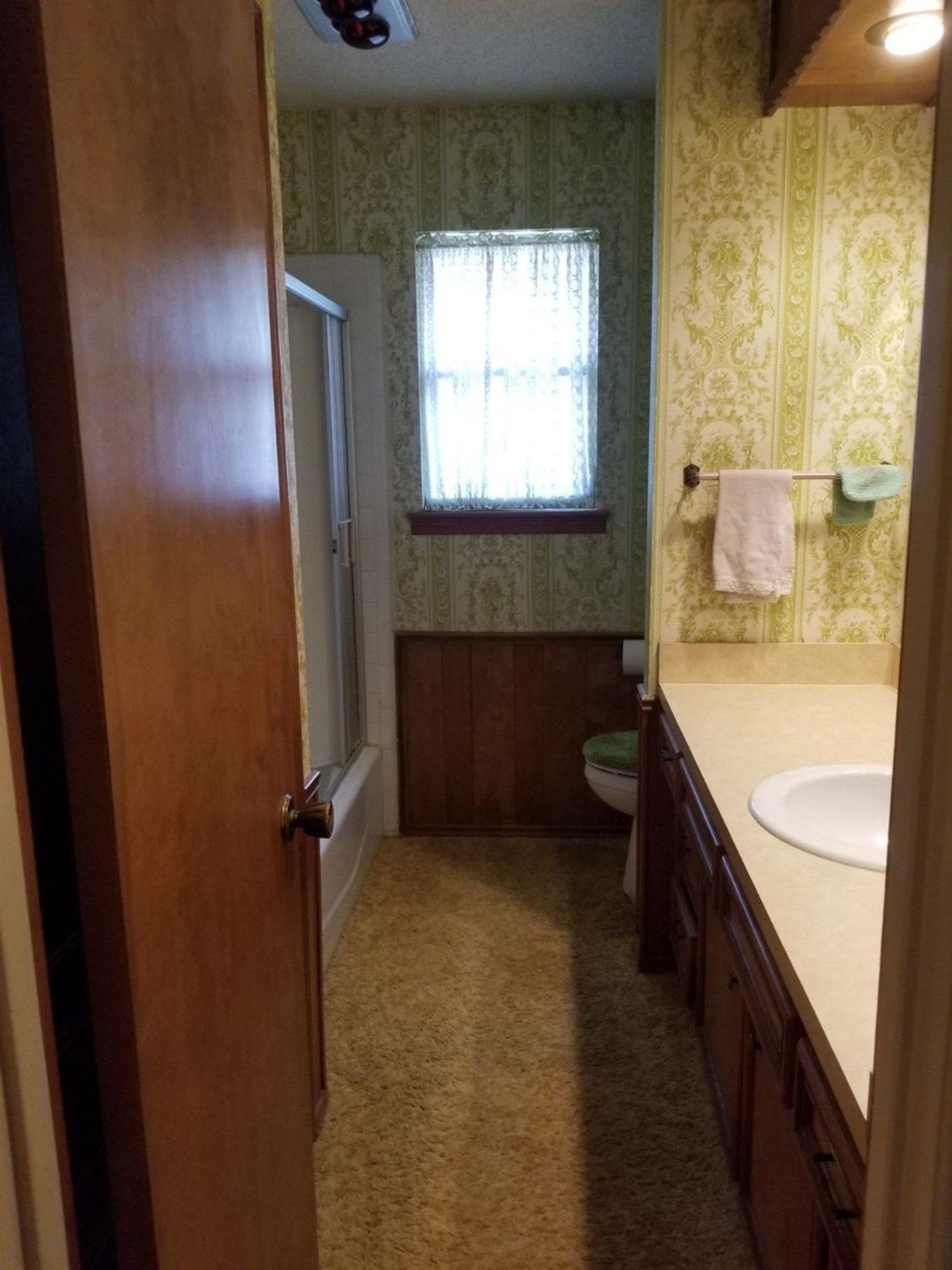 5314 22nd Street Lubbock, TX 79407 - Photo 10 of 10 a bathroom with a granite countertop sink toilet and shower