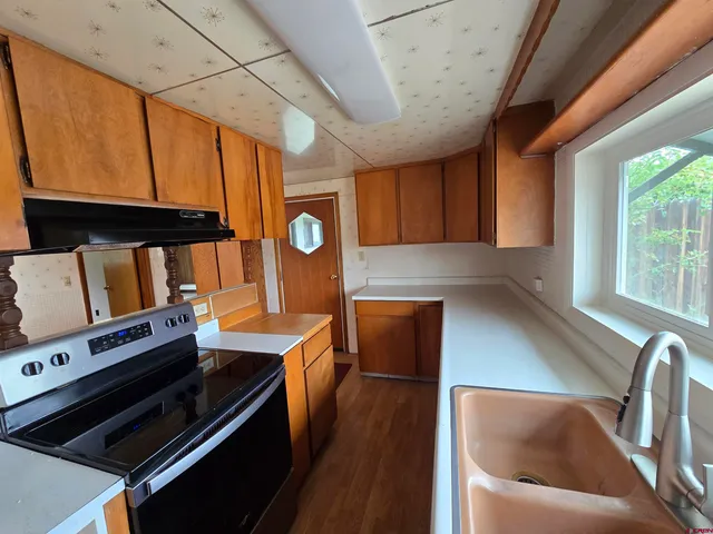 a kitchen with a stove and a microwave