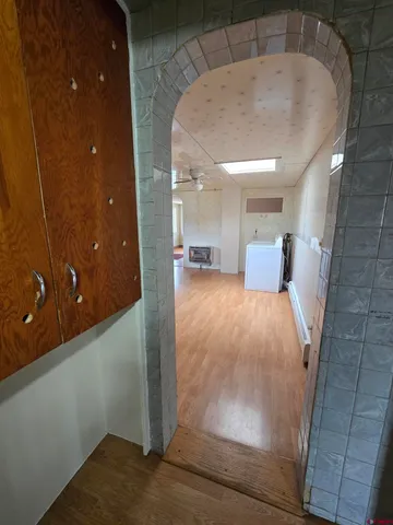 a view of a hallway with a bathroom