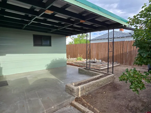 a view of a backyard of the house
