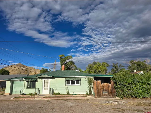 front view of a house with a garden