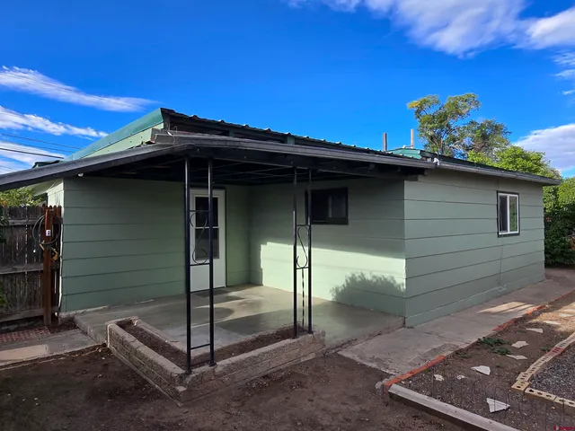 a view of a wooden door of the house