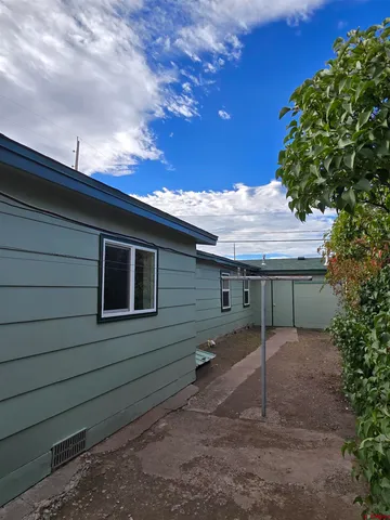 a backyard of a house with lots of green space
