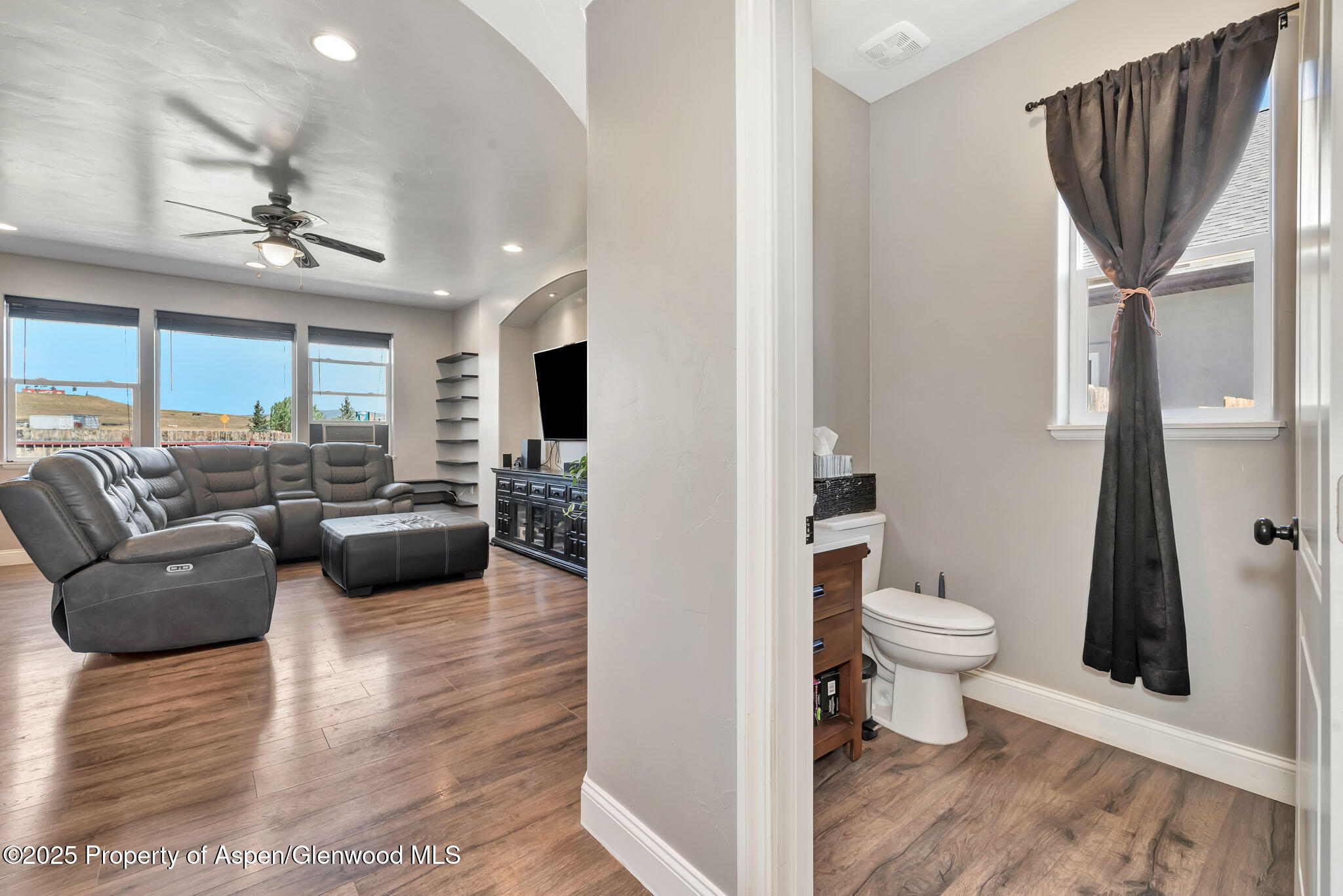 875 Dry Creek Road Hayden, CO 81639 - Photo 16 of 40 a living room with furniture and a flat screen tv