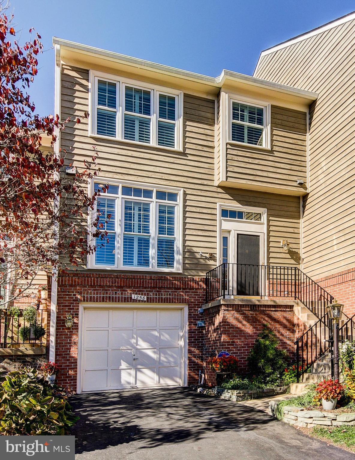 1258 Weatherstone Court Reston, VA 20194 - Photo 1 of 24 a view of a house with a yard