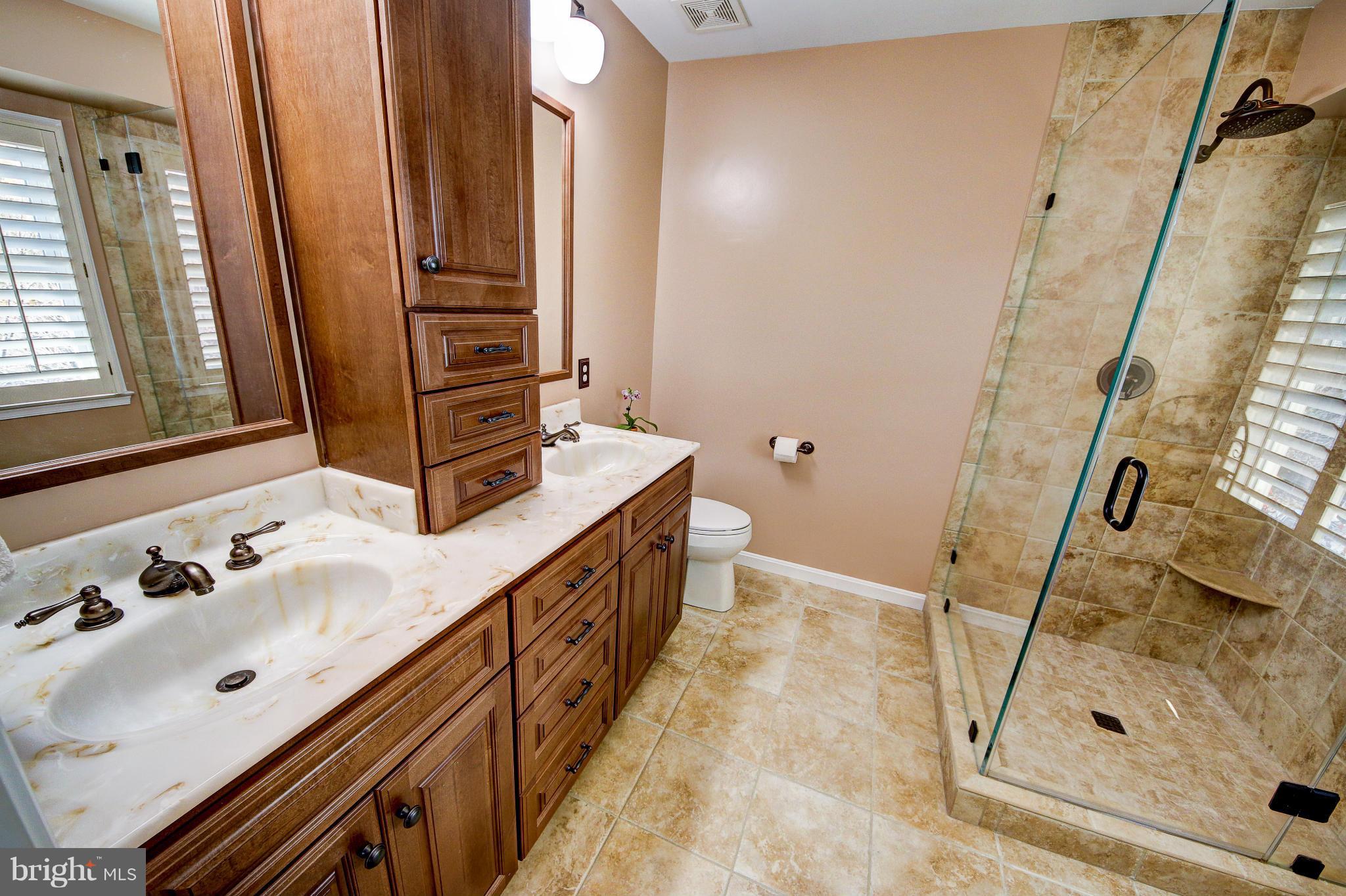 1258 Weatherstone Court Reston, VA 20194 - Photo 15 of 24 a bathroom with double vanity and a sink