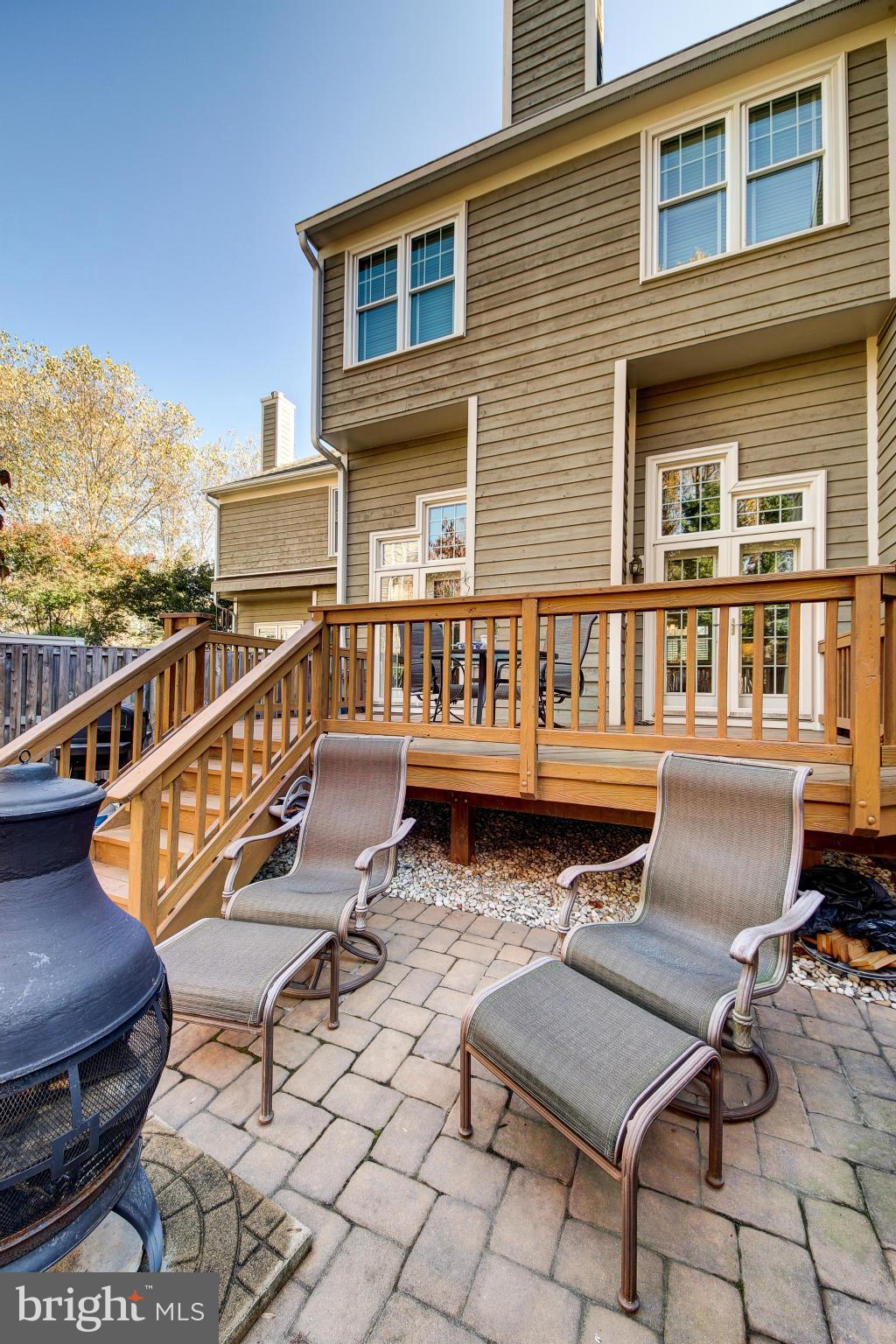 1258 Weatherstone Court Reston, VA 20194 - Photo 22 of 24 a balcony with wooden benches and a barbeque