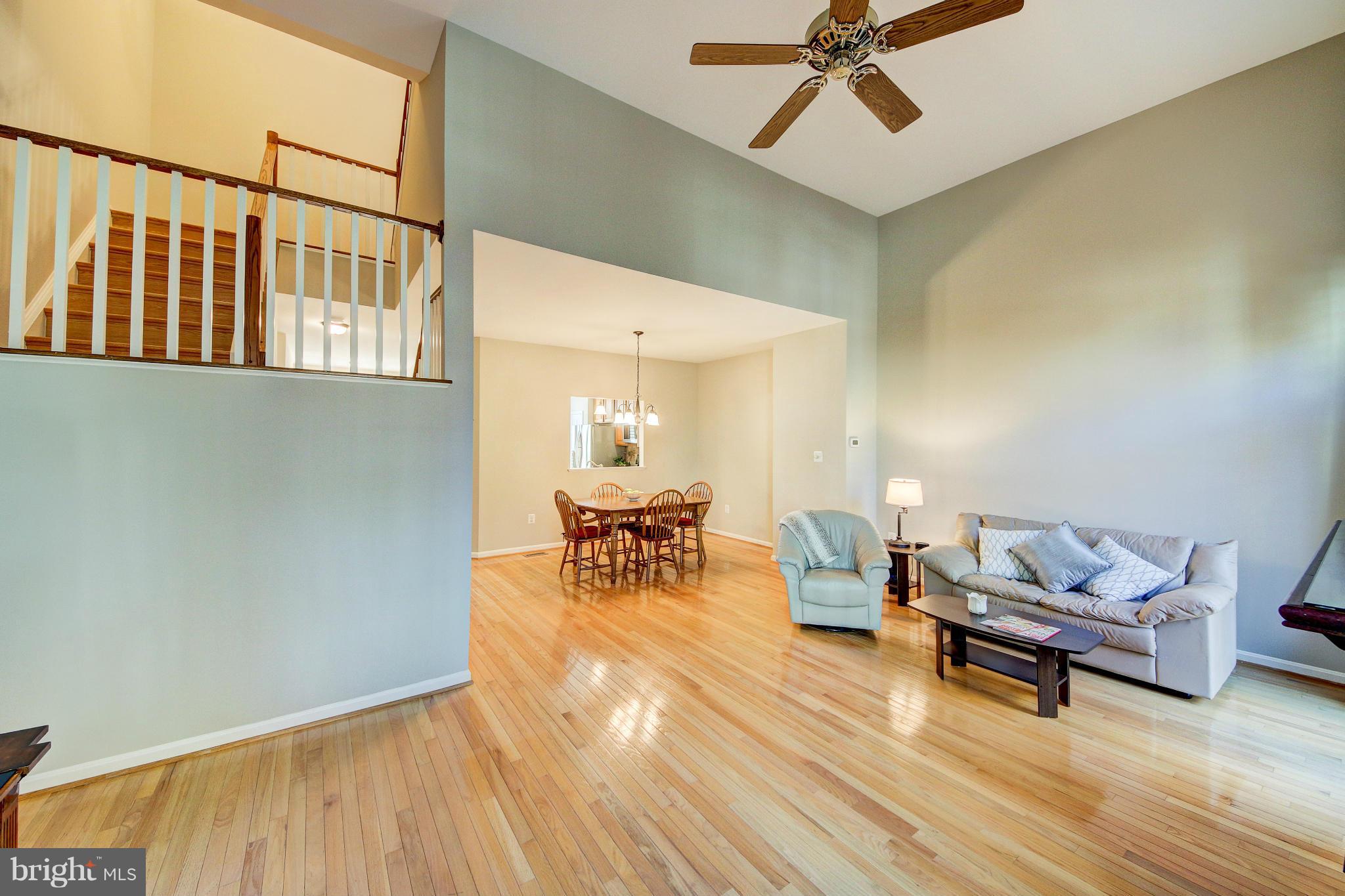1258 Weatherstone Court Reston, VA 20194 - Photo 6 of 24 a living room with furniture and a wooden floor