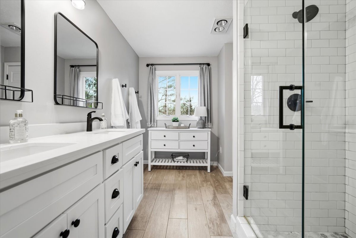 1629 Cheyenne Lane Normal, IL 61761 - Photo 17 of 26 a spacious bathroom with a double vanity sink a mirror and a shower