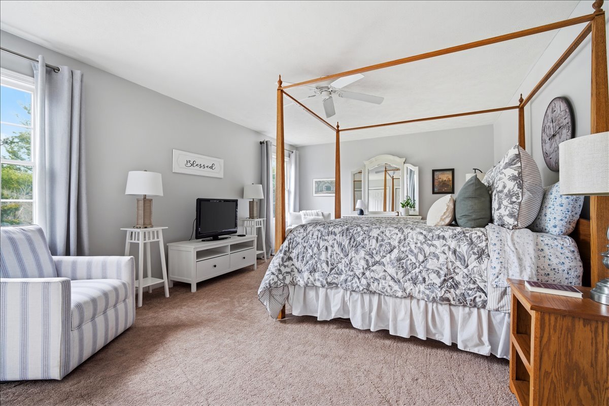 1629 Cheyenne Lane Normal, IL 61761 - Photo 18 of 26 a bedroom with a bed and a couch