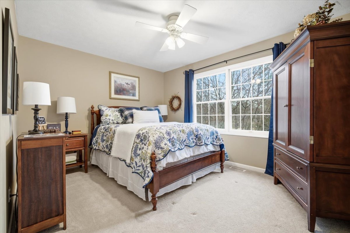 1629 Cheyenne Lane Normal, IL 61761 - Photo 19 of 26 a bed room with a bed and a chandelier