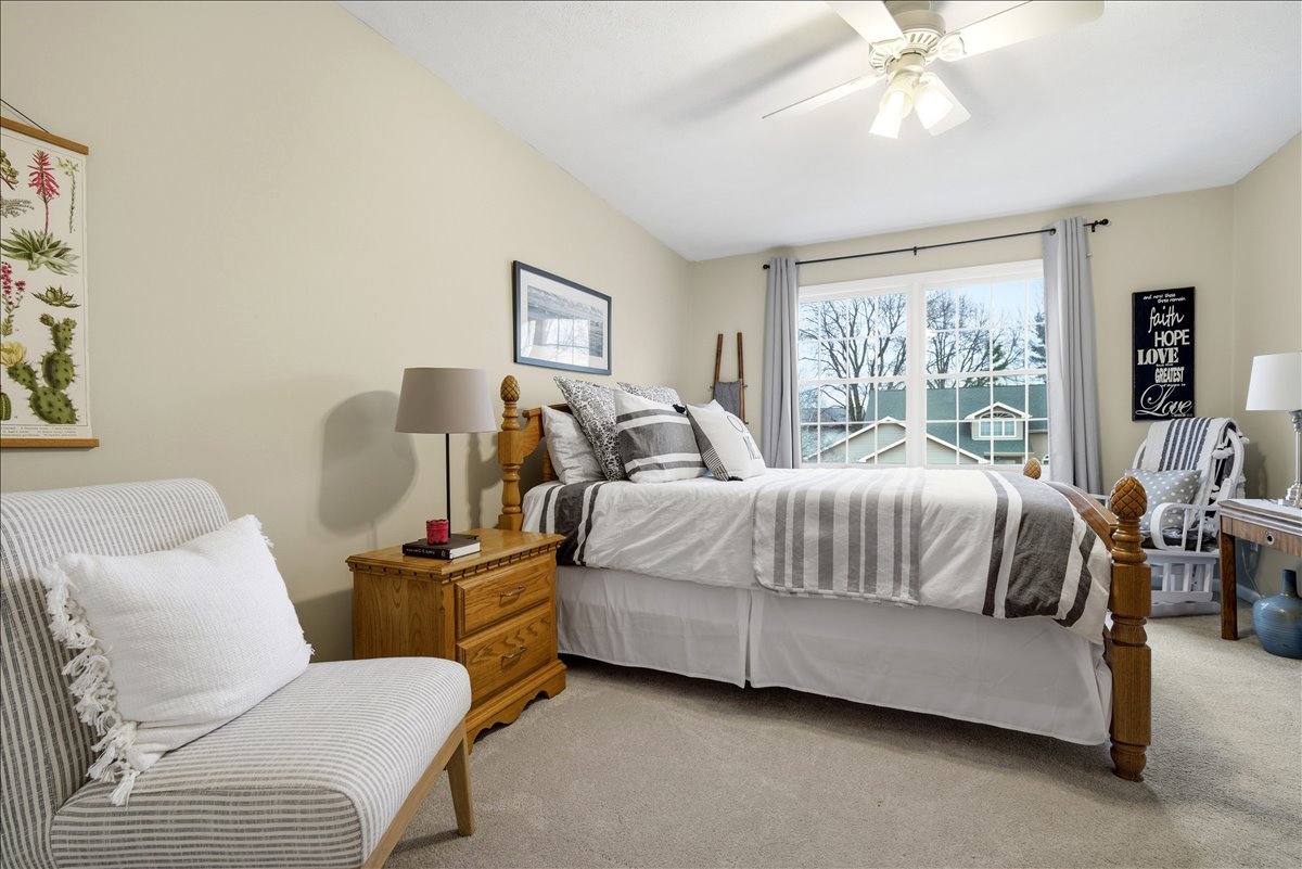 1629 Cheyenne Lane Normal, IL 61761 - Photo 21 of 26 a bedroom with a bed a couch and dresser