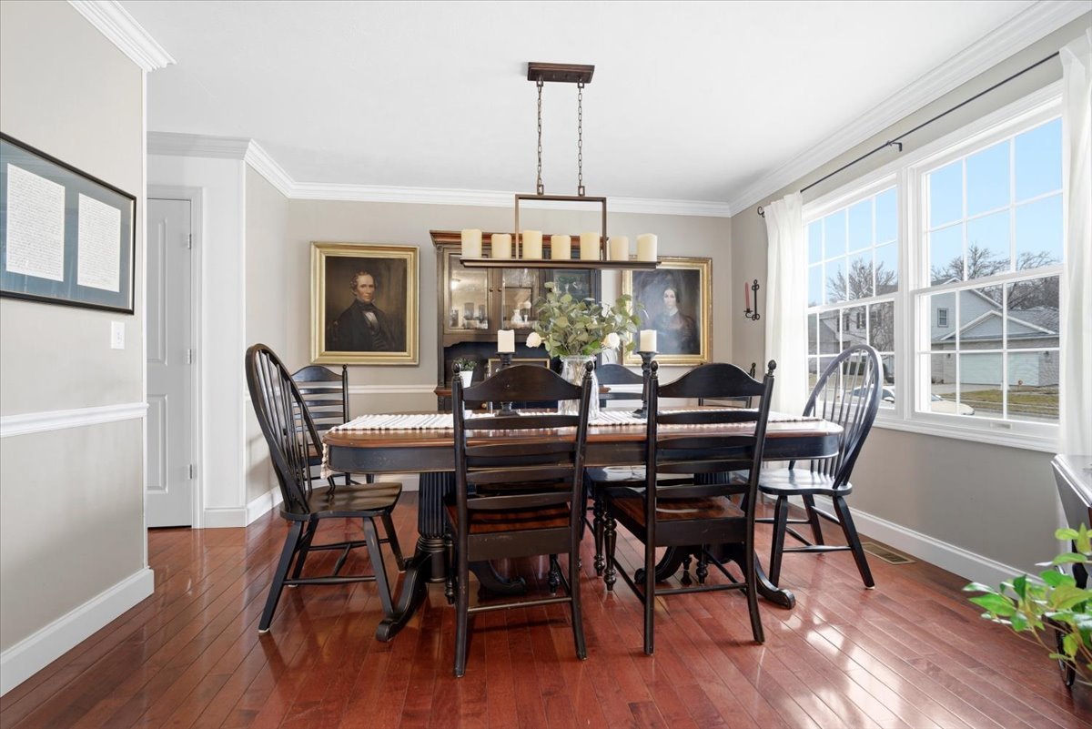 1629 Cheyenne Lane Normal, IL 61761 - Photo 8 of 26 a view of a dining room with furniture window and wooden floor
