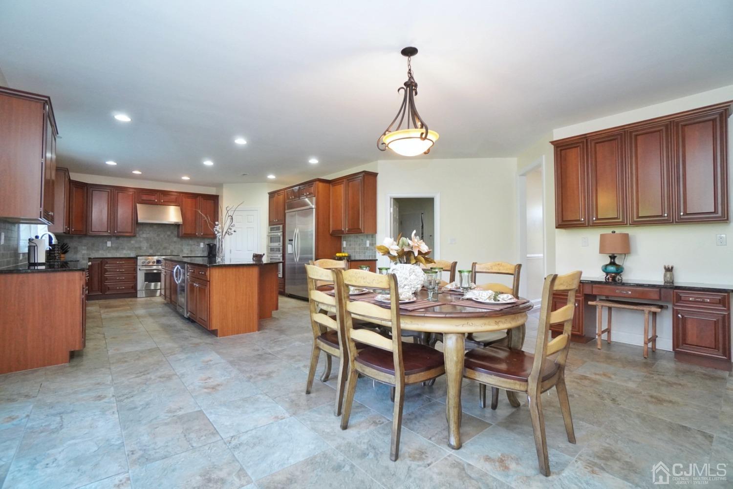 12 High Ridge Lane Augusta, NJ 07822 - Photo 17 of 49 a view of a dining room and a table and chairs in the kitchen