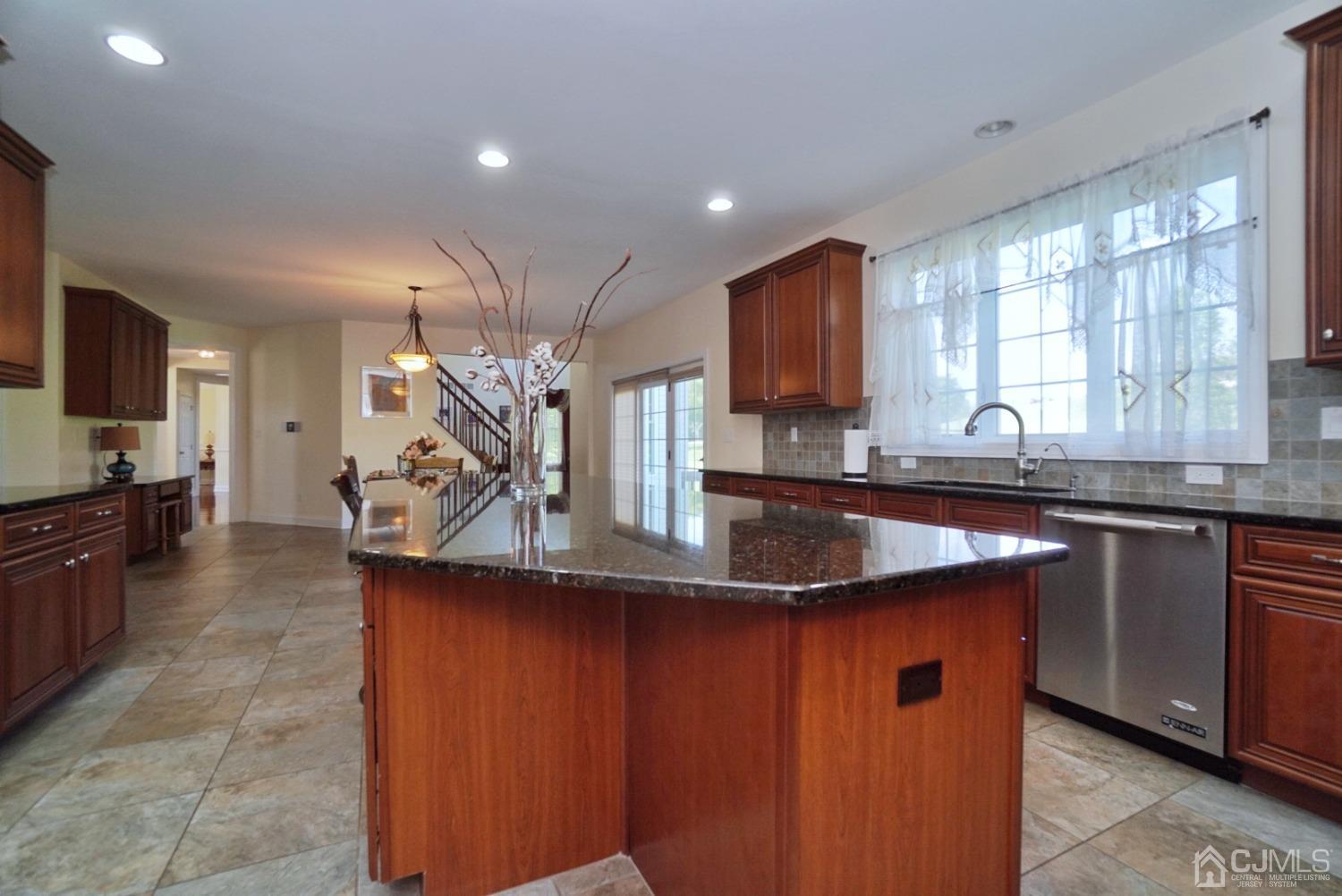 12 High Ridge Lane Augusta, NJ 07822 - Photo 20 of 49 a kitchen with stainless steel appliances granite countertop a sink a stove counter space and cabinets
