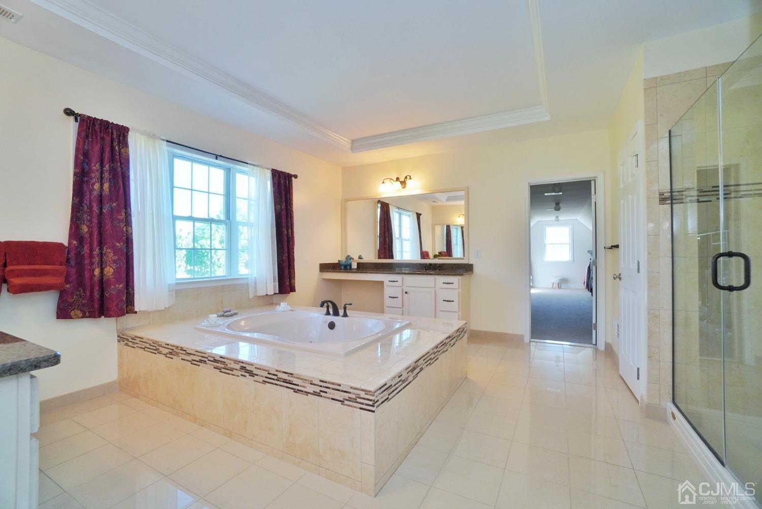 12 High Ridge Lane Augusta, NJ 07822 - Photo 33 of 49 a spacious bathroom with a tub sink and mirror