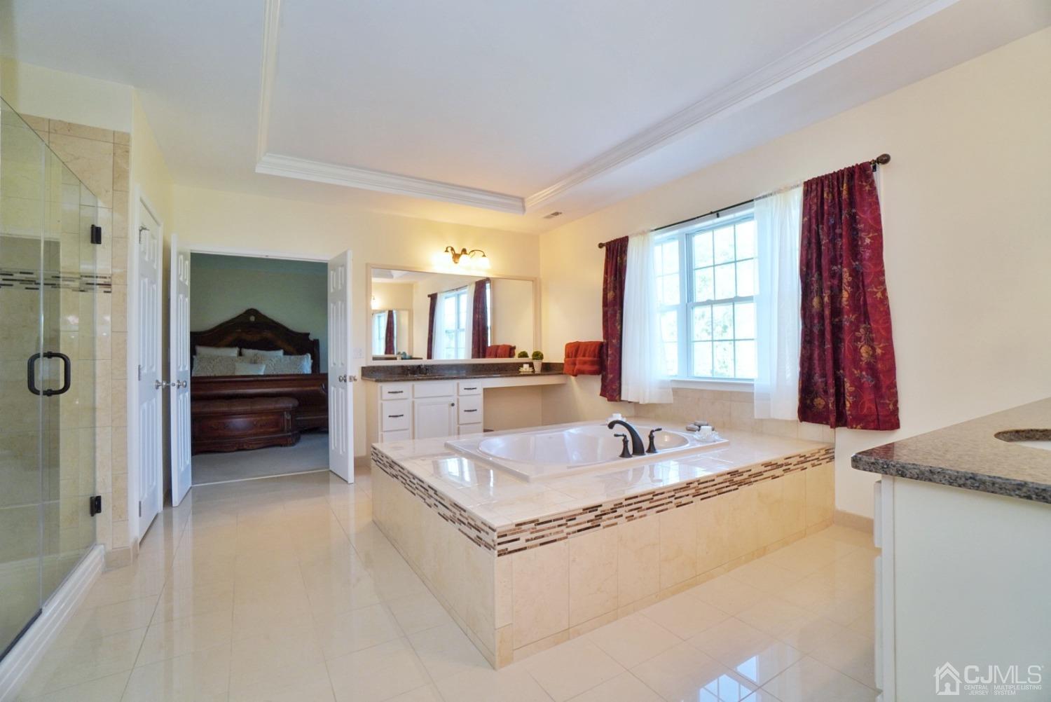 12 High Ridge Lane Augusta, NJ 07822 - Photo 34 of 49 a spacious bathroom with a granite countertop tub sink and mirror