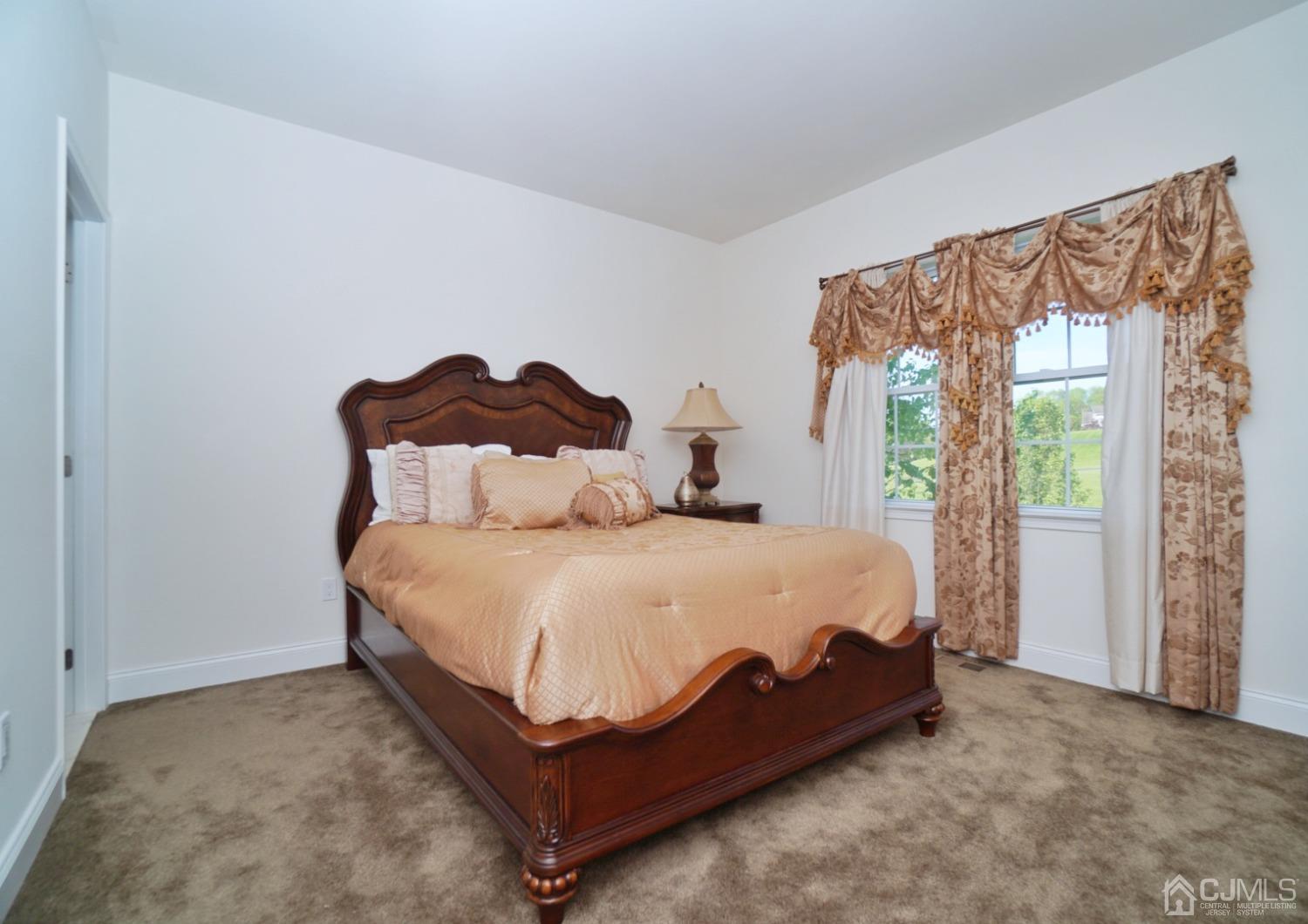 12 High Ridge Lane Augusta, NJ 07822 - Photo 38 of 49 a bed sitting in a bedroom next to a window