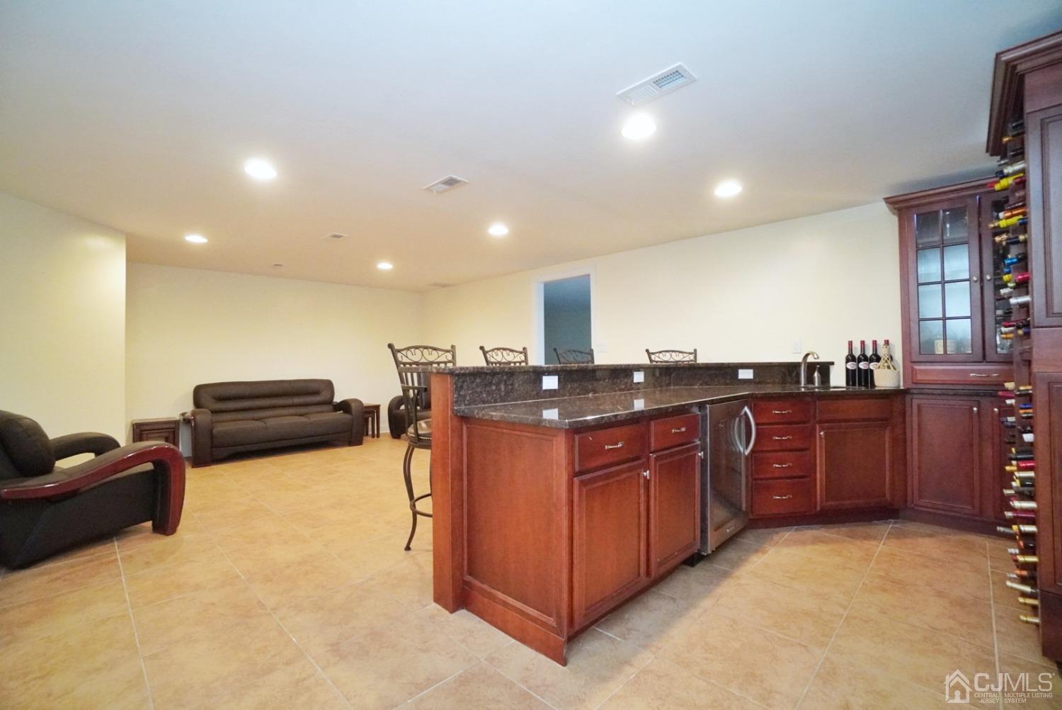 12 High Ridge Lane Augusta, NJ 07822 - Photo 42 of 49 a kitchen with stainless steel appliances granite countertop a stove a sink and a refrigerator