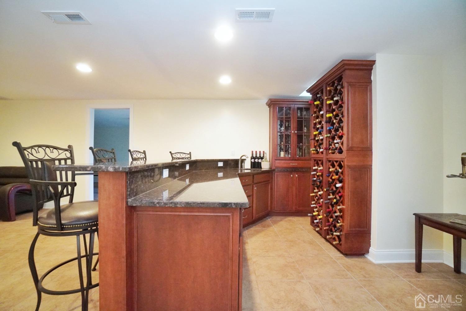 12 High Ridge Lane Augusta, NJ 07822 - Photo 43 of 49 a kitchen with stainless steel appliances granite countertop a sink a stove and a refrigerator