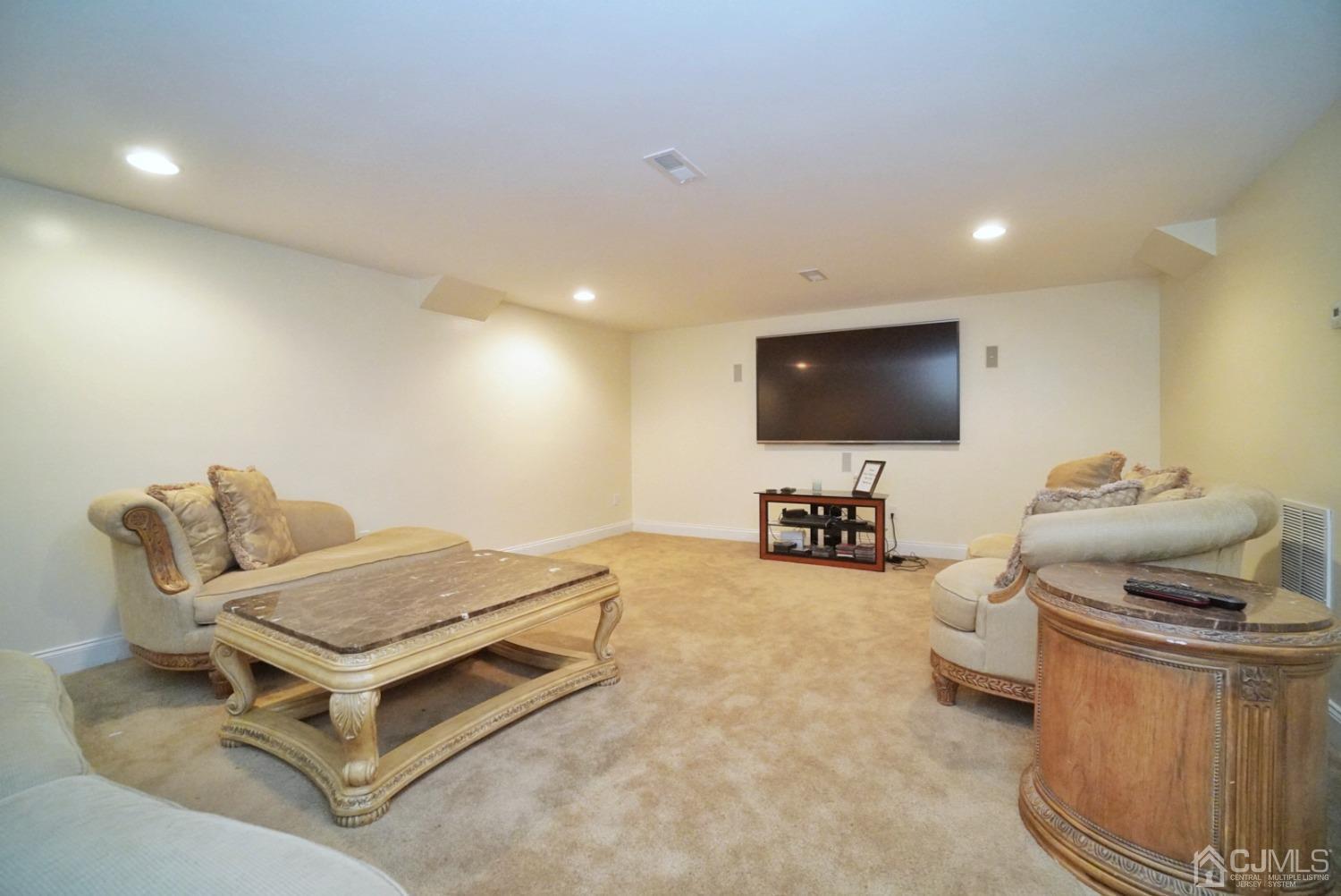 12 High Ridge Lane Augusta, NJ 07822 - Photo 44 of 49 a living room with furniture and a flat screen tv