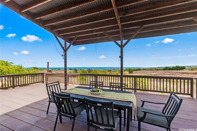 a view of balcony with furniture