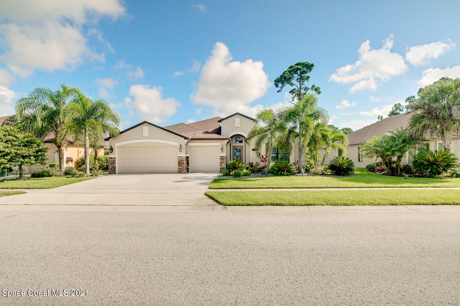 1398 Outrigger Circle Rockledge, FL 32955 - Photo 2 of 51 a front view of a house with a yard and trees