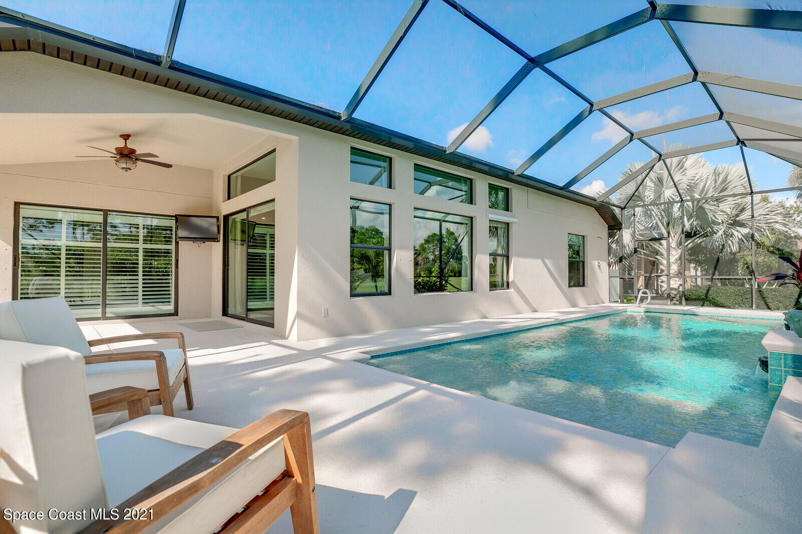 1398 Outrigger Circle Rockledge, FL 32955 - Photo 12 of 51 a view of a patio with table and chairs and potted plants