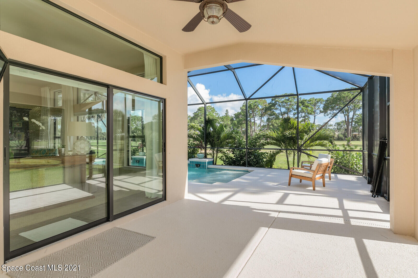 1398 Outrigger Circle Rockledge, FL 32955 - Photo 13 of 51 a view of porch with a table and chairs under an umbrella