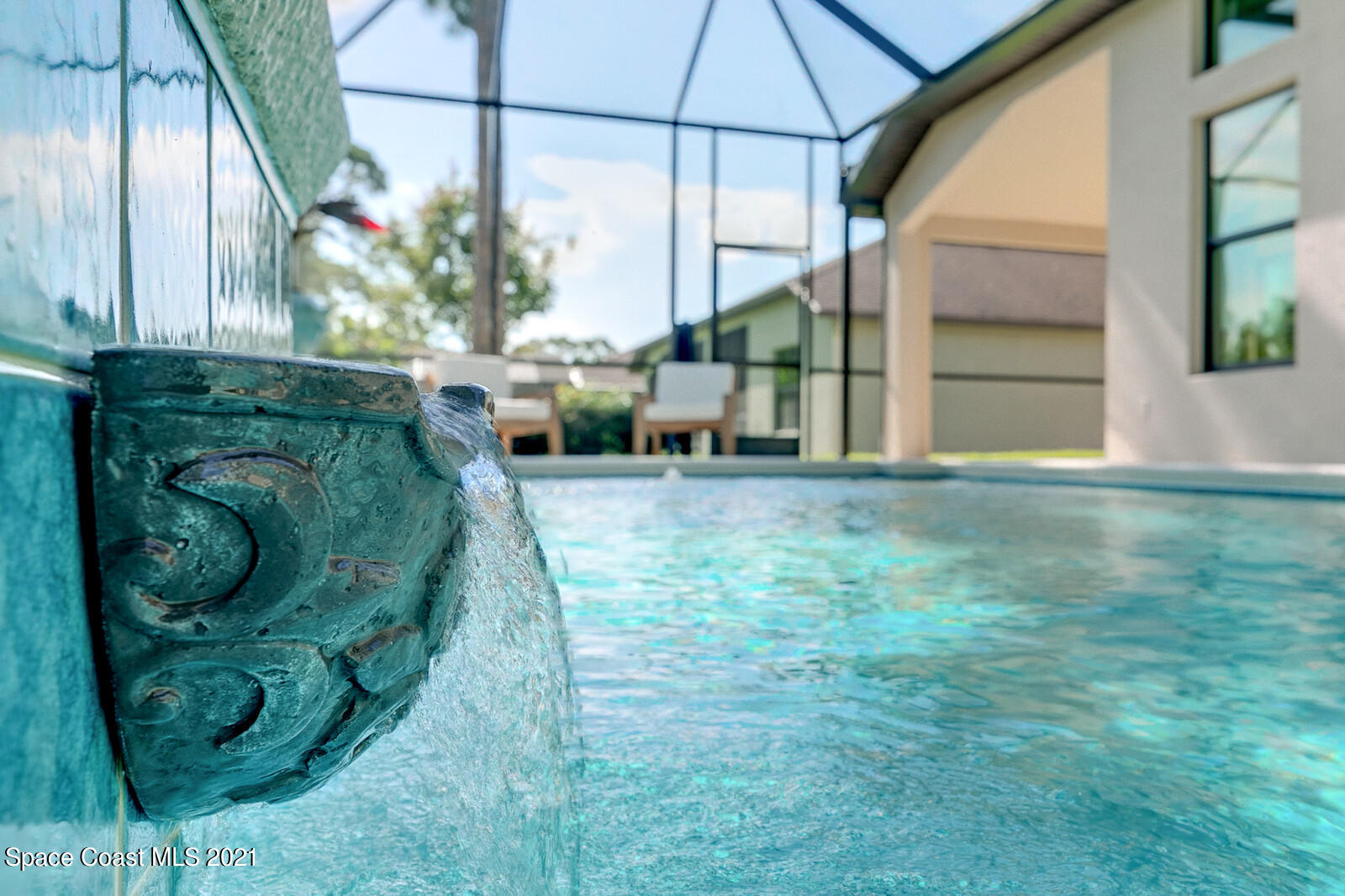 1398 Outrigger Circle Rockledge, FL 32955 - Photo 14 of 51 a backyard of a house with table and chairs