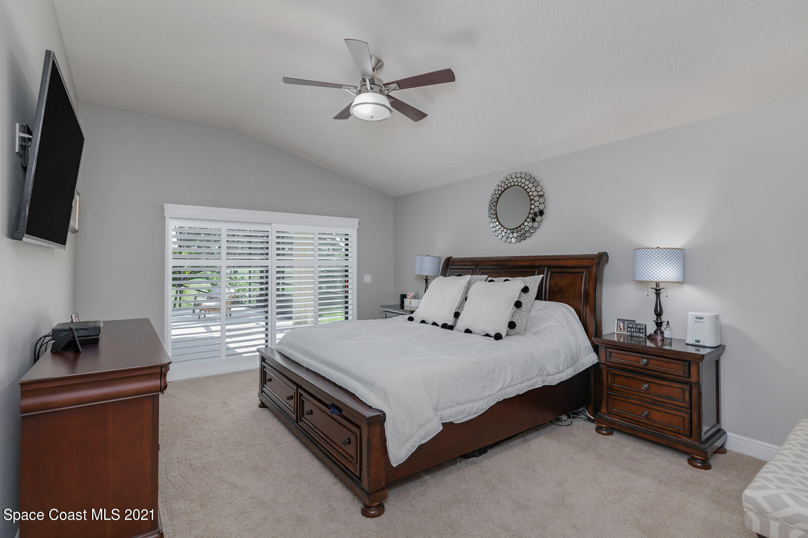 1398 Outrigger Circle Rockledge, FL 32955 - Photo 17 of 51 a bedroom with a bed and a computer on the desk