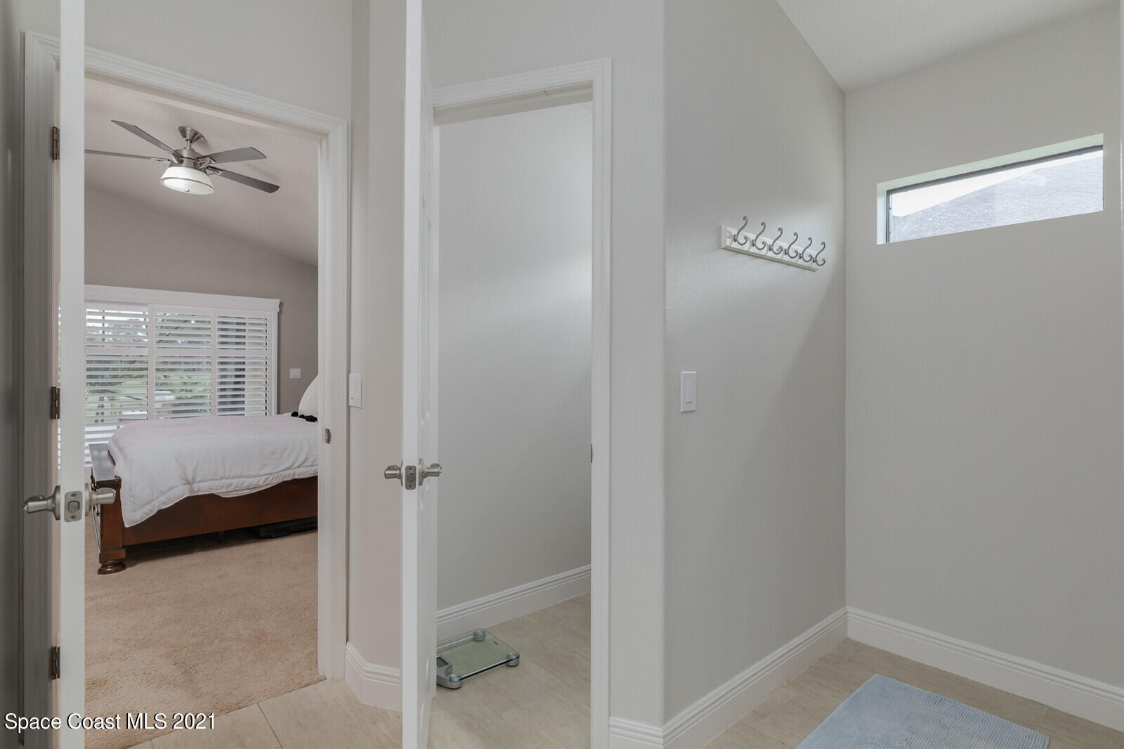 1398 Outrigger Circle Rockledge, FL 32955 - Photo 21 of 51 a bedroom with a bed and a view of bathroom